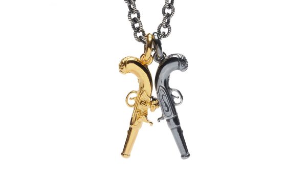 Double flinklock pistol necklace. One silver, one gold vermeil. on rope link chain with T bar clasp